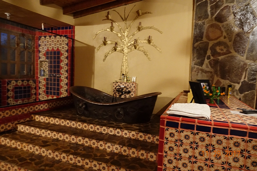 luxury bathroom with elaborate stairs to a soaking tub.